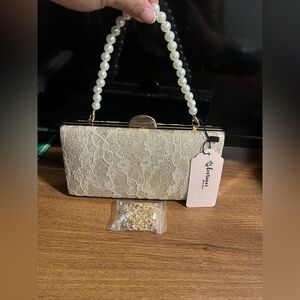 Elegant Golden Lace Clutch with Pearl Handle